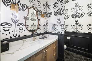 Bathroom featuring vanity and tile flooring