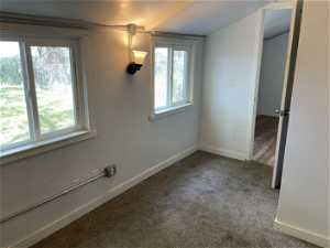 Spare room with hardwood / wood-style flooring and a textured ceiling