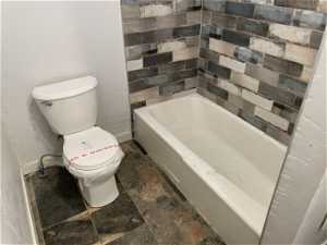 Bathroom with tile floors and toilet