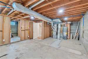 Basement featuring water heater and heating utilities and laundry! Great unfinished space for whatever you would like!