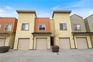 Townhome / multi-family property with a garage