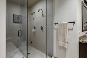 Full bathroom with a stall shower and vanity