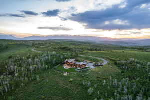 Aerial view of property's location with a mountain backdrop