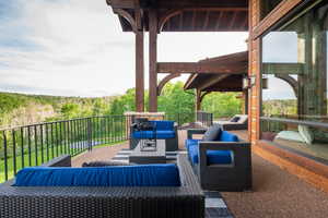 View of patio with an outdoor hangout area
