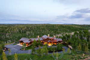 View of subject property featuring a forest
