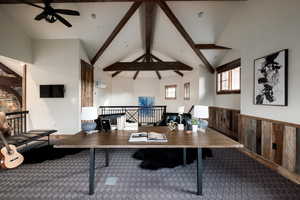 Carpeted office space with a ceiling fan