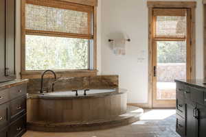 Full bath featuring a bath and vanity