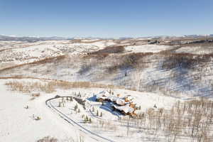 Snowy aerial view with a mountain view