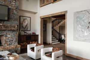 Living room featuring stairs and wood finished floors