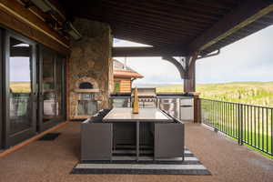 View of patio featuring area for grilling