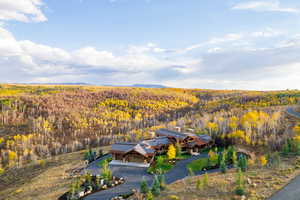View of subject property with a heavily wooded area
