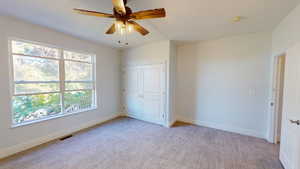 3rd spacious bedroom with large windows and plenty of natural light