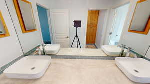 Large countertop with two sinks in the jack-and-jill bathroom