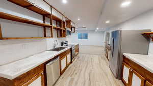 Basement kitchen with full-sized appliances and plenty of cabinet/shelving space