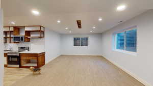 View of the basement family room and kitchen area