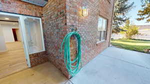 View of the rear patio and entrance into the basement