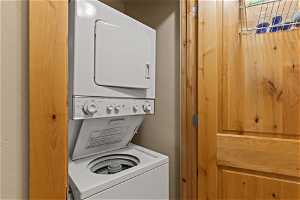 Laundry area featuring stacked washer and clothes dryer