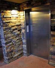 Entrance to property featuring elevator