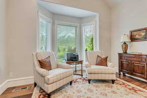 Living area with wood-type flooring