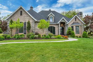 View of front of house with a front yard