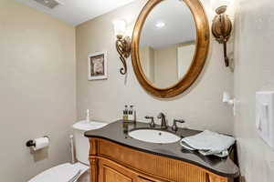 Bathroom with vanity and toilet