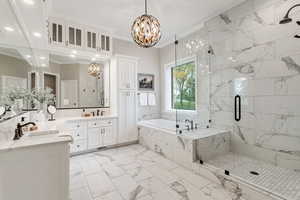 Bathroom featuring oversized vanity, independent shower and bath, crown molding, tile flooring, and double sink