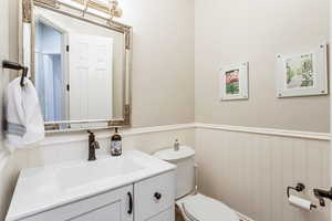 Bathroom featuring vanity and toilet