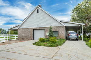 View of home's exterior featuring a carport