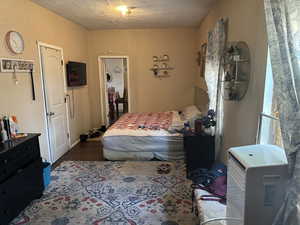 Another view of the Bedroom #3 featuring a textured ceiling