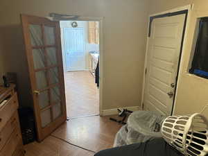 Bedroom featuring a closet and light parquet floors