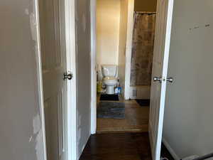 Bathroom #1 shared at the Old House. Hallway featuring dark hardwood / wood-style flooring