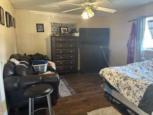 Last Bedroom #1 featuring ceiling fan and dark hardwood / wood-style flooring