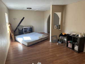 living with dining area upstairs Building #2 with dark wood-type flooring