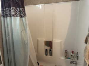 Bathroom with shower / bath combo with shower curtain