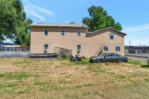 Back of house featuring a yard