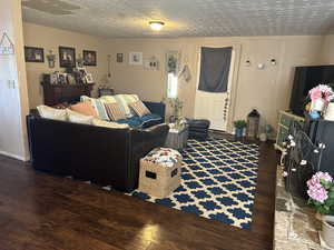 Old House Living room with dark wood-type flooring and a textured ceiling