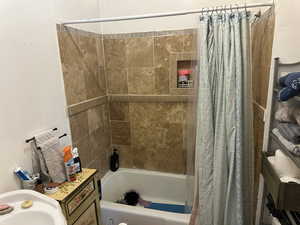 Bathroom featuring sink and shower / tub combo