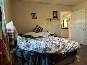 Bedroom #1 on the Back Building #2 featuring hardwood / wood-style flooring and ensuite bathroom