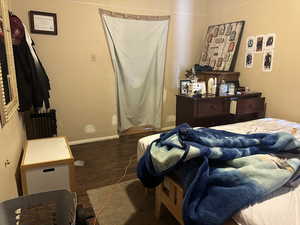 Bedroom #2 Other view with radiator and dark hardwood / wood-style flooring