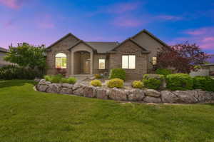 View of front of property featuring a lawn