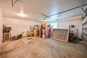 Garage featuring a garage door opener