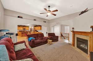 Living room featuring ceiling fan and light tile floors