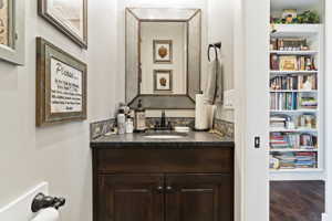 Half Bathroom with tile flooring