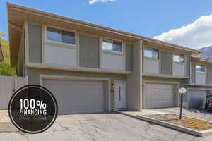 View of property featuring a garage