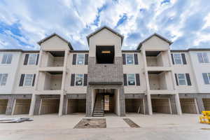 View of property with a garage