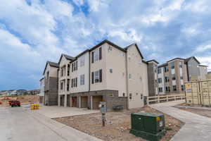 View of building exterior featuring a garage