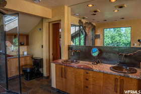 Kitchen featuring stone countertops and sink