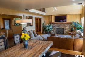 Dining room featuring a stone fireplace