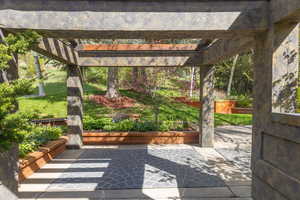 View of terrace featuring a pergola