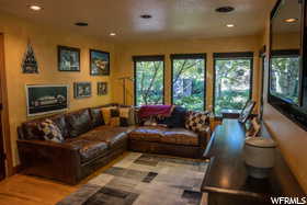 Living room with light hardwood / wood-style flooring